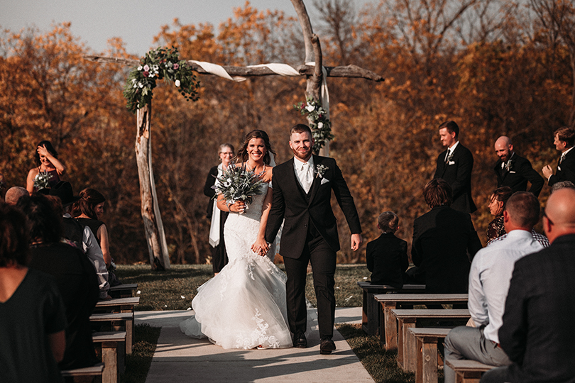 Bride and Groom walking down the aisle